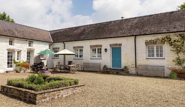 THE OLD CARRIAGE COURT, pet friendly, with open fire in Kidwelly