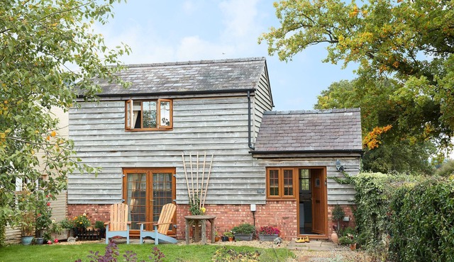 The open-plan living space includes a well-equipped kitchen with all you need to prepare some delici