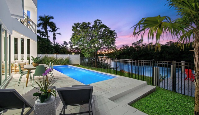 The Riverhouse – A Stunning Modern Heated Pool Retreat with Serene and Scenic Waterway Views!