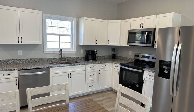 The Snowman Suite - newly constructed home with a water front view.