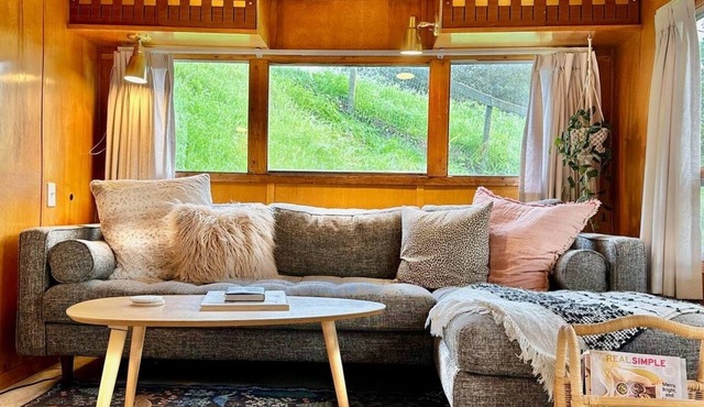 The Spartan is a fun 1950's vintage trailer under oak trees overlooking a 1 acre organic farm!