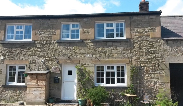 'The Stables'. A lovely stone built cottage in the small village of Powburn.