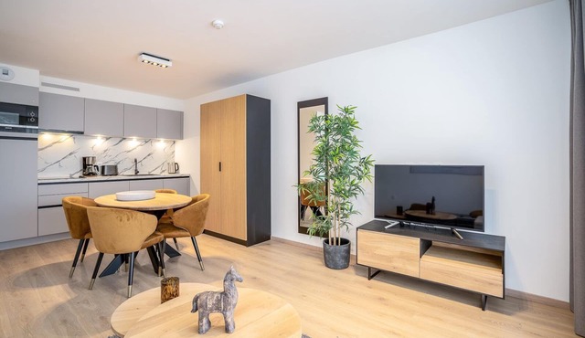 The studio offers a cozy bedroom with a double bed