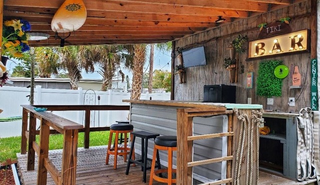 The Tiki Hut Oasis, a tropical Beach home with firepit, patio, and more!