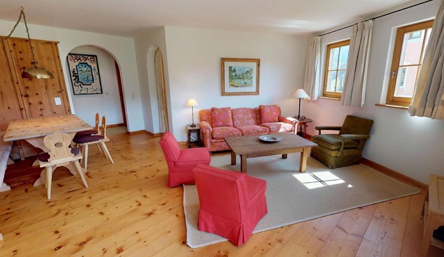 The traditional Chesa Marmotta is situated next to the famous River "Inn" in a v