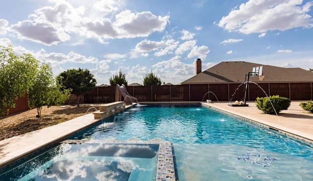 The ultimate resort ranch style pool home on nearly a half acre!