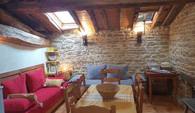 The yellow cottage, made of stone and wood