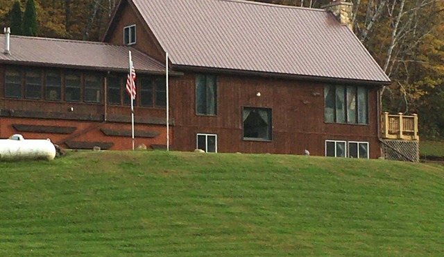 This 3 story home is set on a hillside & includes all imaginable amenities.