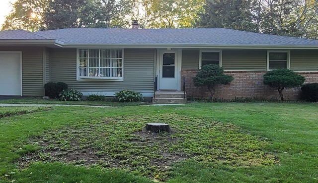 This 4 BR Home With A Great Game Room Is Located Close To Shopping And Dining