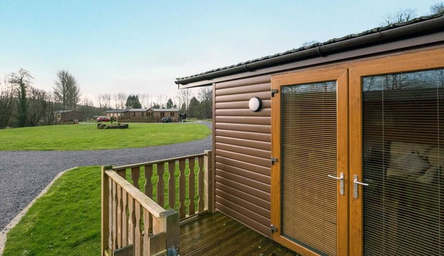 This beautiful traditional lodge situated within a woodland setting is the perfect location for you