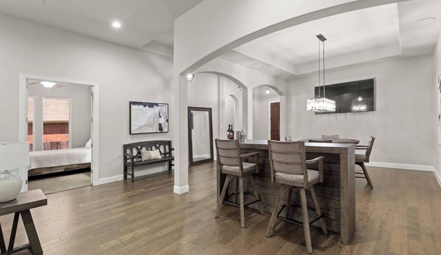 This beautiful 3200 SF single storey with loft backs onto a heavily treed forest