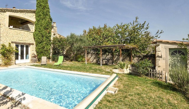 This beautiful and spacious stone vacation home welcomes you on a large and wooded property.