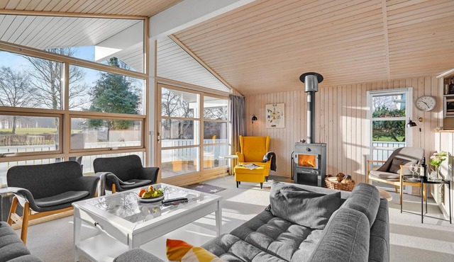 This beautiful wooden house is located in a smaller cottage area, nestled in beautiful nature.
