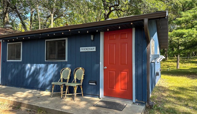 This camper cabin with attached bathroom makes the perfect summer camp retreat!