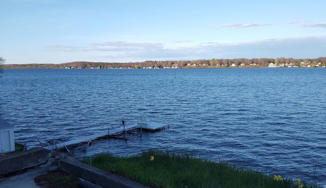 This Cottage offers dramatic views of Hamlin Lake with 150 feet of lakefront