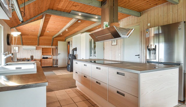 This cozy cottage is located under a romantic thatched roof.