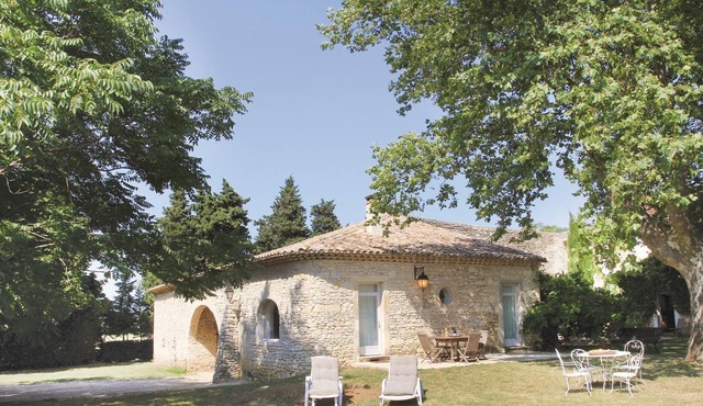 This delightful vacation property, adjacent to a large traditional country house, is situated on a g