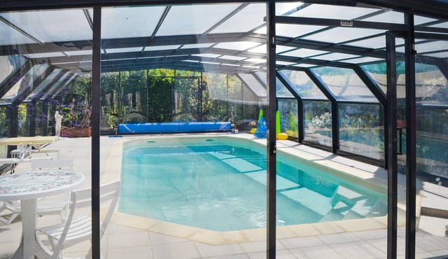 This elegant house is located in a large residential area of the town of Pacé, 10 km from Rennes.