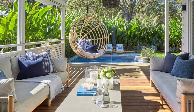 This home matches quaint beachside charm with luxurious comfort.