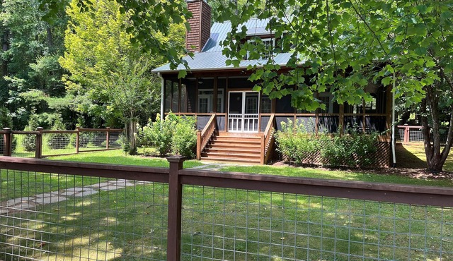 "This house lives for the lake!” Flat, fenced-in yard, no stairs to Lake Rabun.