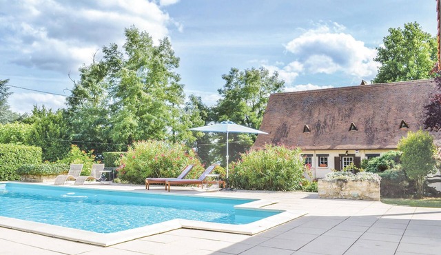 This inviting vacation home with private pool is nestled in a beautiful enclosed garden.