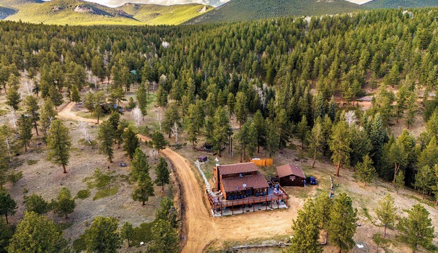 This is Colorado! Stunning views, killer hot tub, 12 acres, game barn+huge deck!