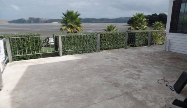 This is the one, pristine kiwi bach by the water!