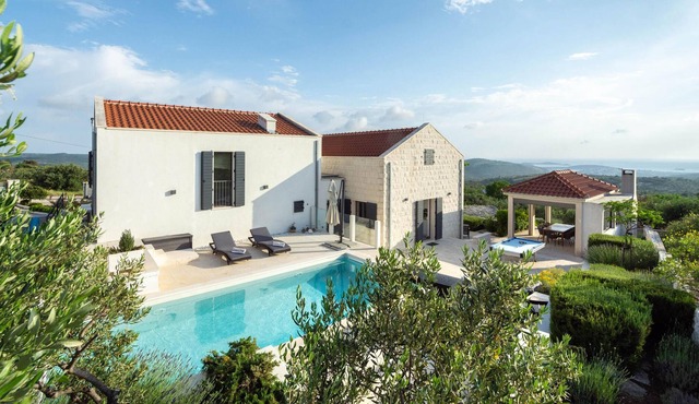 This modern and bright vacation home is located in a small village in the hinterland of Rogoznica.