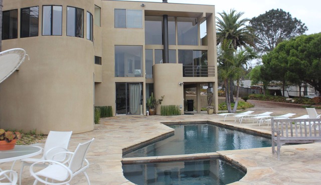 This modern home is a bike ride away from the beach on a private street.