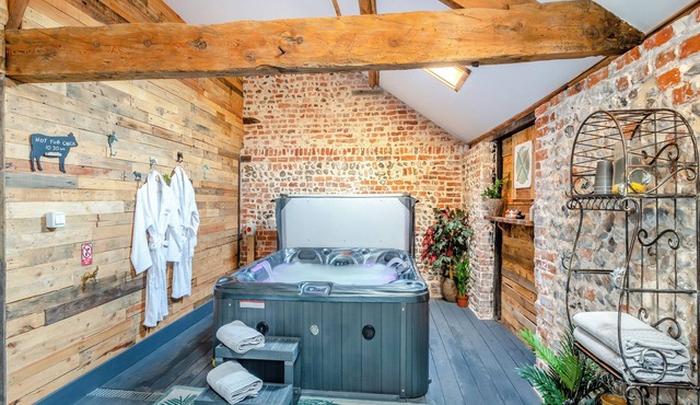 This picture-perfect barn conversion, boasts a private hot tub and sauna.