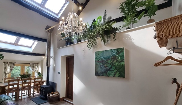 This pretty barn offers much character including oak beams and a gallery bedroom.