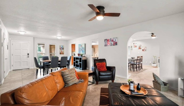 This spacious home has all you need with 2 primary suites, 2 guest bedrooms, and 3 bathrooms. There is no shortage of living space with a living room, 2 dining rooms, open floor plan w/fully-stocked kitchen, and onsite laundry.
