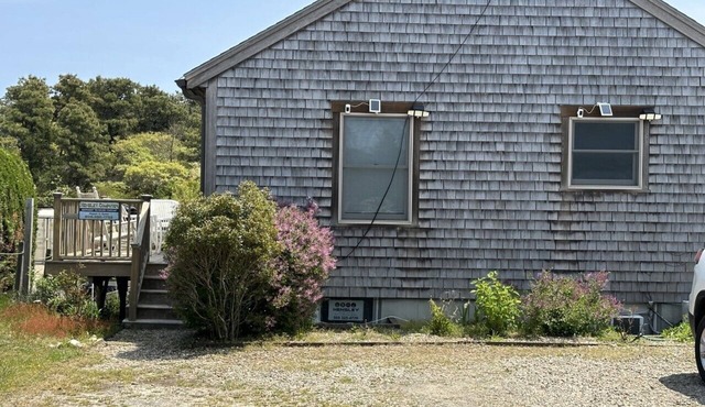 This two-bedroom cottage features one queen bed, two twin beds, and a sofa bed.