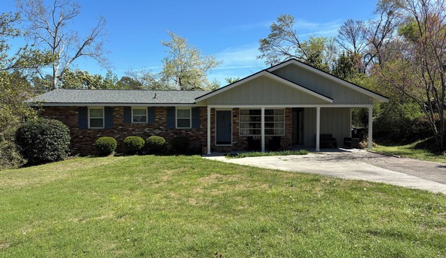 This updated brick home is ready for the Masters! Just a 5-min Uber ride.