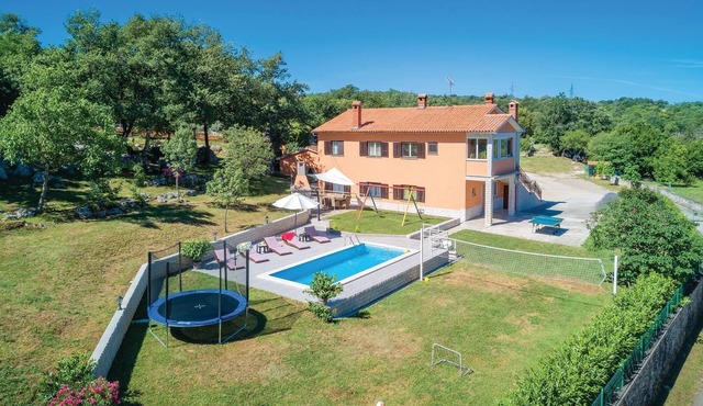 This vacation home with pool has a spacious outdoor area and konoba (social room).