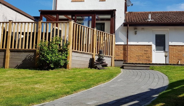 Three bedroom pet friendly detached property with conservatory and large lit decking area.