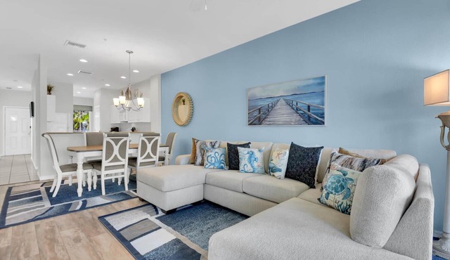 Three bedroom second floor golf condo in Lely Resort with lake views from screened lanai