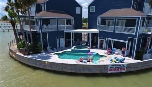 Three Bedroom, Three and a Half Bath. Private Boat Slip. Communal Pool.