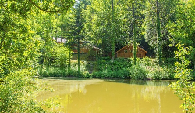 Timber lodge set by the lake with one double and one twin.
