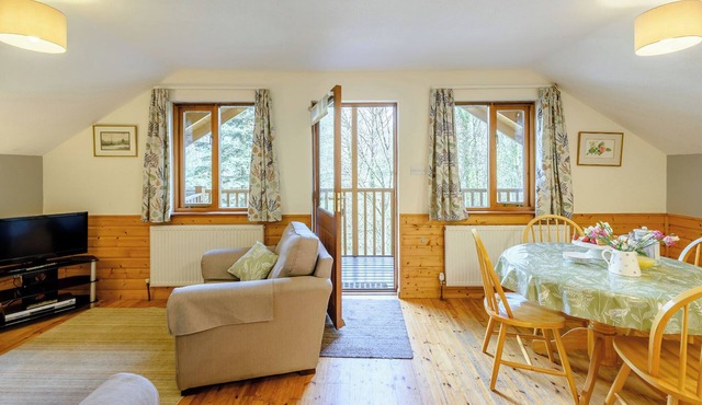 Timber lodge set by the lake with one double and one twin.