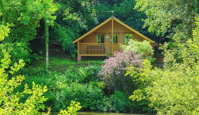 Timber lodge set by the lake with one double and one twin.