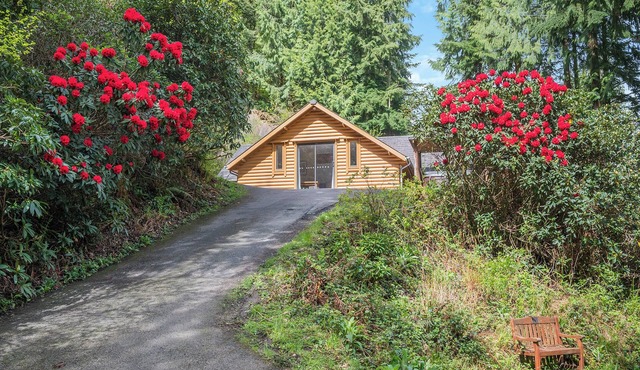 Timber lodge set in an elevated position with views of the lakes.