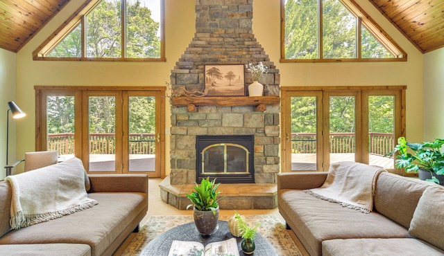 Timber Ridge Lake House is a private lake home in Amery Wisconsin. The home balances the warmth of a large A-Frame with modern decor and finishes providing a serene stay with woods and lake views.