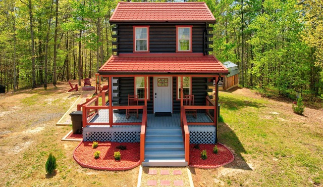 Tiny cabin next to a small farm-fire pit, hot tub, grill, disc golf, cornhole