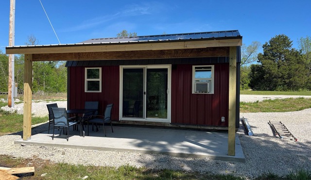 Tiny cabin set in back of the property. Great for a quiet couples getaway.