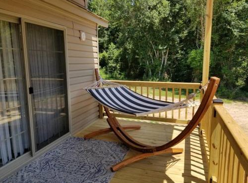 Tiny home with hammock loft BBQ and yard