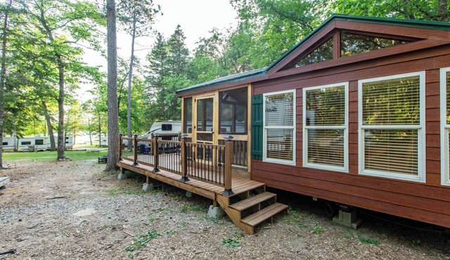 Tiny house nestled in the woods with lake view. Pets Accepted!