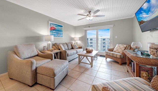Top-floor 2/2 condo with ocean and pool views, private balcony, and heated beachfront pool