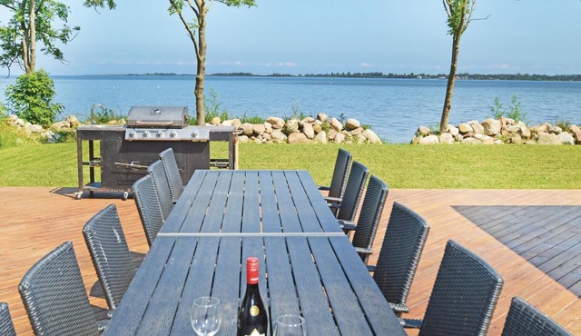 Top house in the first row on the water.