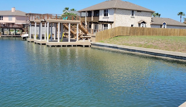 Top Level Canal Water Front Home With Boat Dock & Extra Parking!